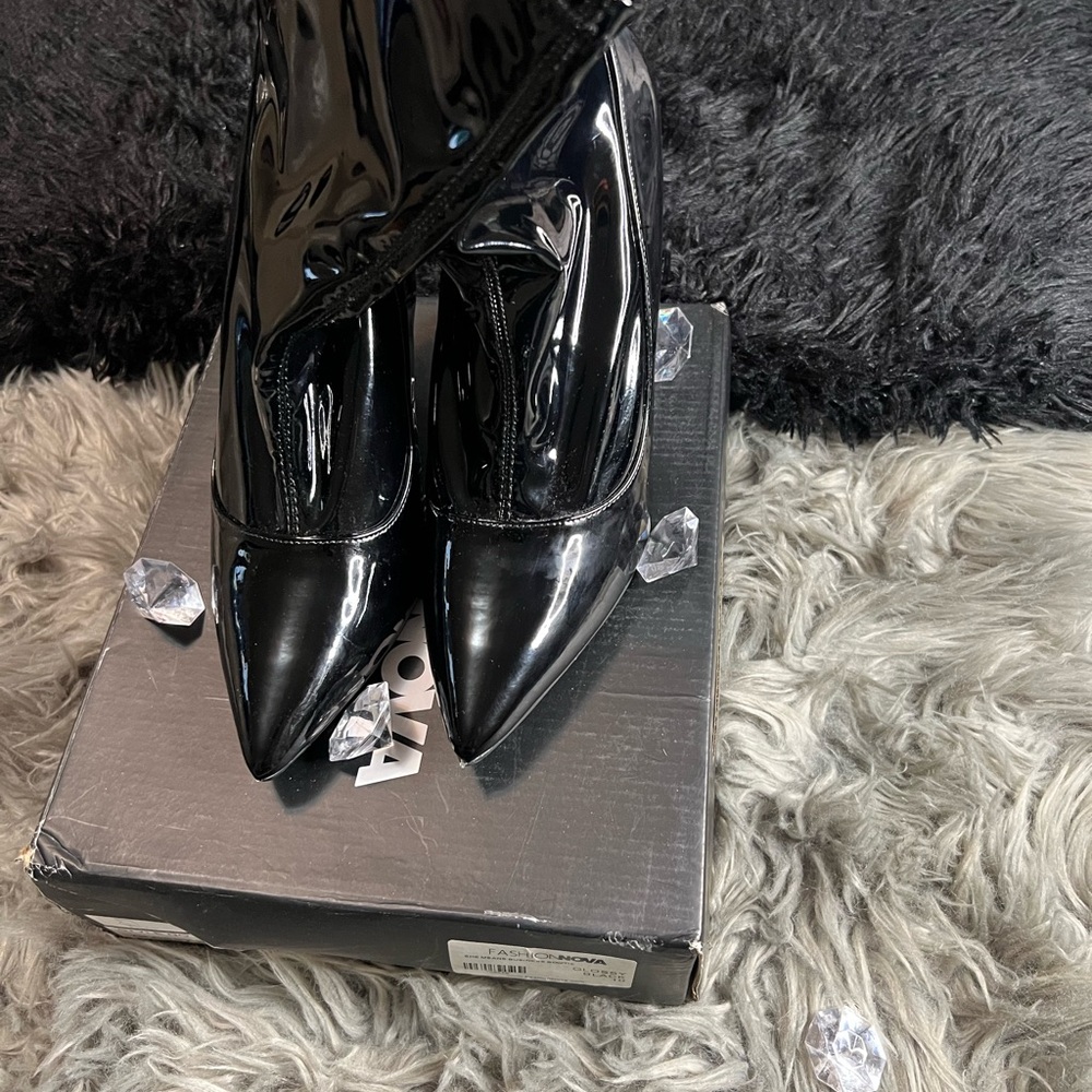 Stylish  glossy black ankle boot